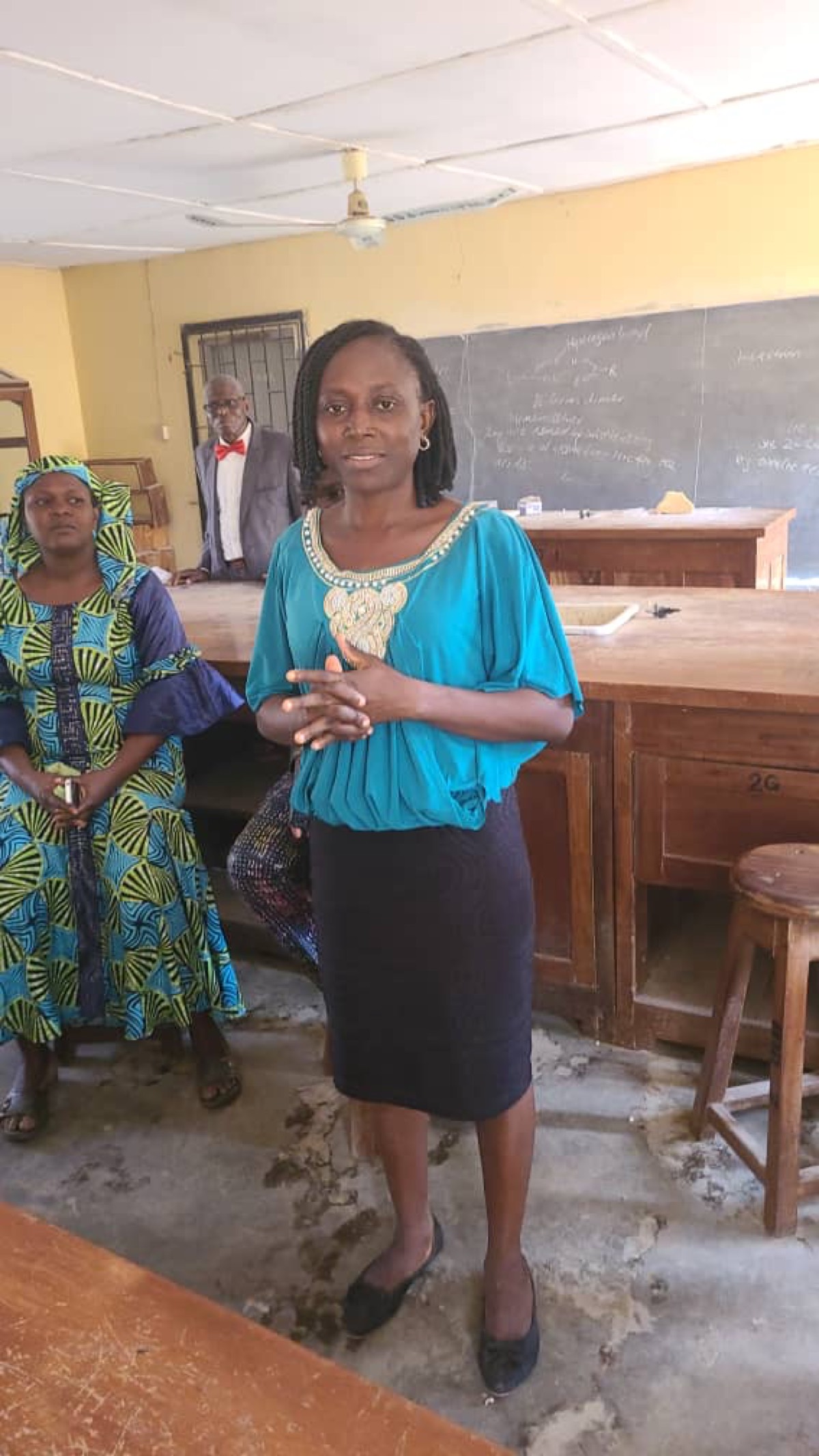 A woman speaking in a school laboratory.