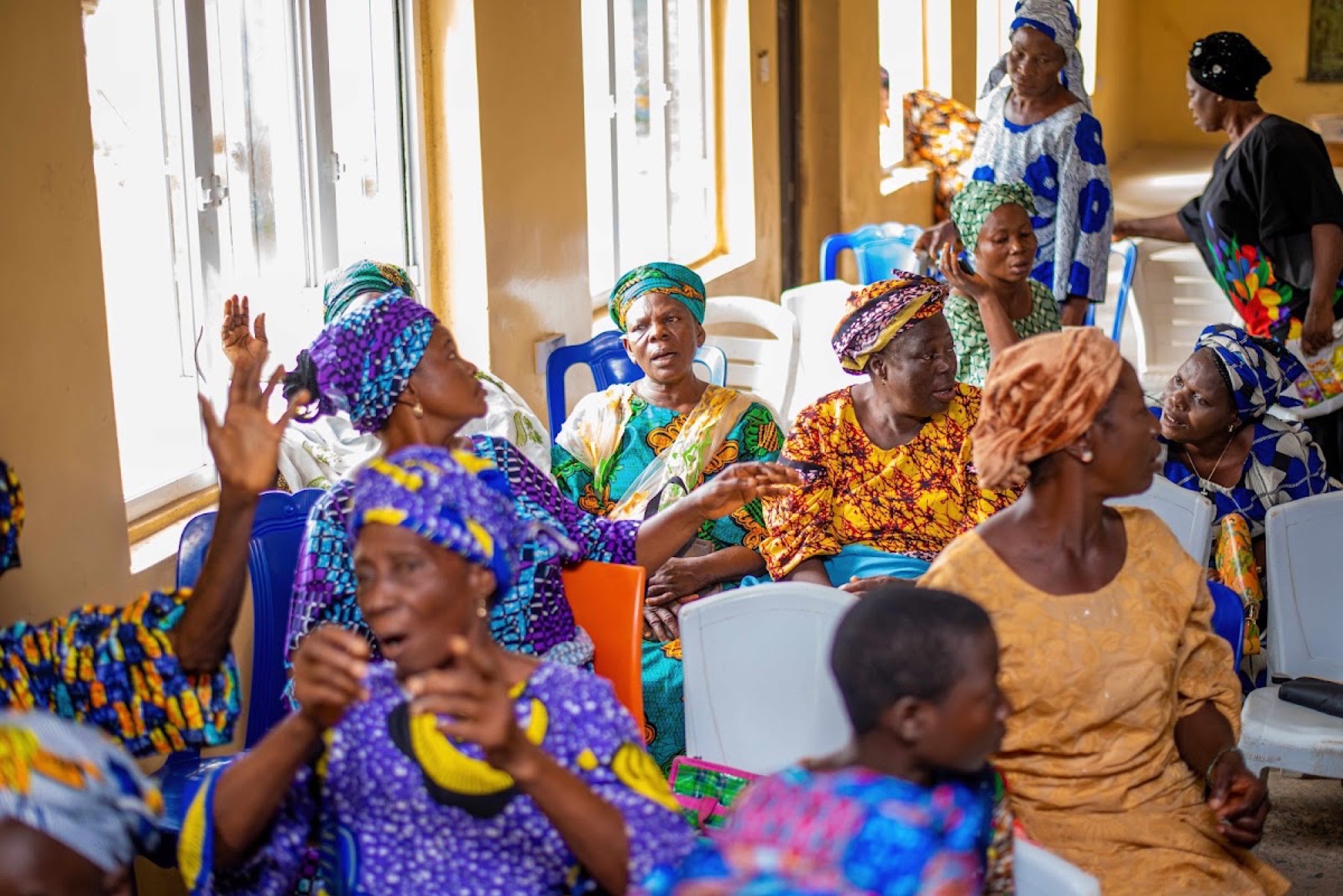 Women singing together at a foundation programme.